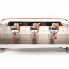 This image is a front view of the Slayer Steam X in bone beige, with dura-tex accents, 3 groups at traditional height and manual dosing controls.
